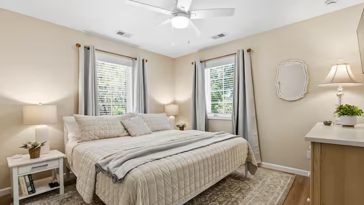 Tranquil bedroom with king bed and blackout curtains